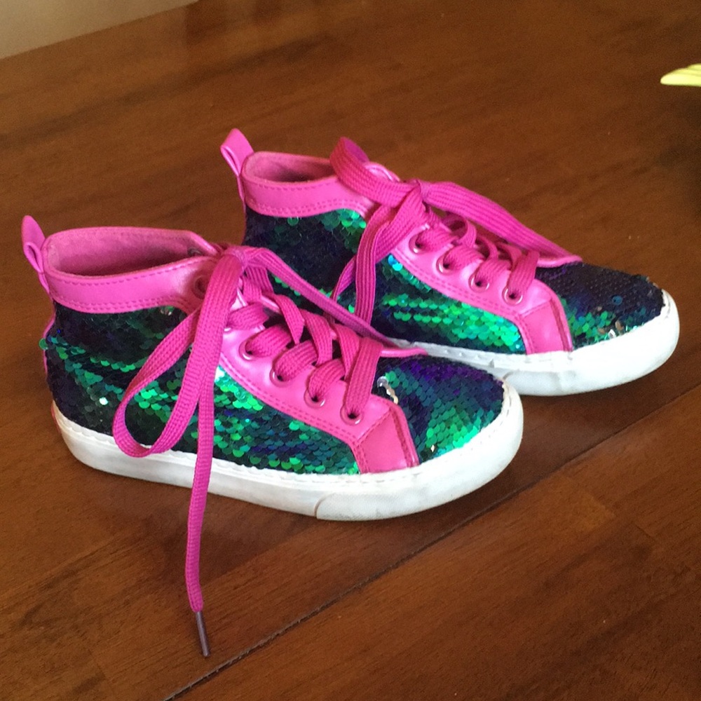 JoJo Siwa sequined hightop shoes.